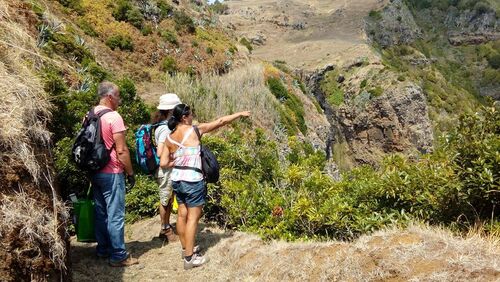 Listening to the guide while hiking to Maia